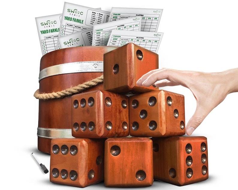 May include: A set of six large wooden dice in a natural brown color, stacked in a pyramid shape. The dice are used for a yard game called "Yard Farkle". A wooden barrel and scorecards are also included in the image.
