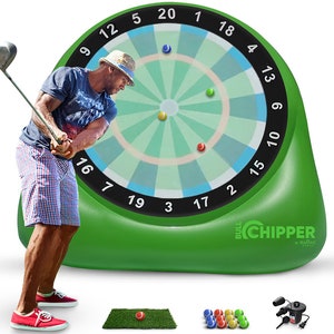 May include: An inflatable green golf target with a dartboard design. The target has numbers 1-20 around the outside and a bullseye in the center. There are golf balls and a green putting mat in the foreground. The text "BULL CHIPPER" is printed on the target.