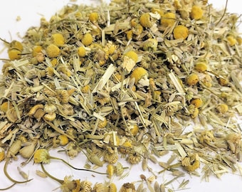 May include: A close-up of a pile of dried chamomile and lavender flowers, a popular herbal tea blend.