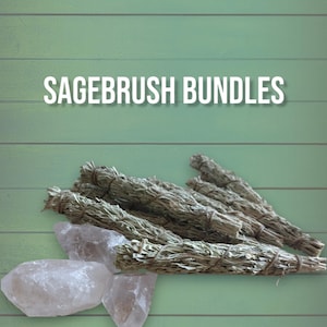May include: Sagebrush bundles, also known as white sage, are tied together with twine and arranged on a green wooden surface with clear quartz crystals.