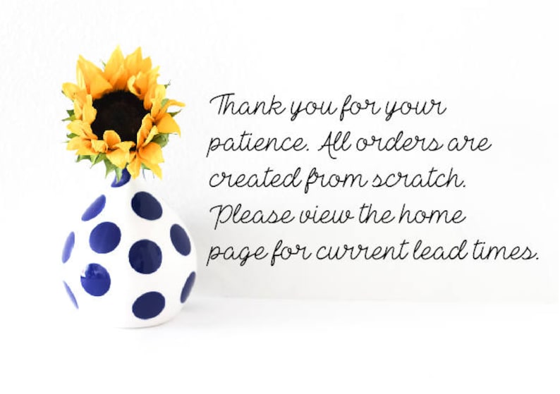 May include: A white vase with blue polka dots holds a bright yellow sunflower. The image includes the text: "Thank you for your patience. All orders are created from scratch. Please view the home page for current lead times."