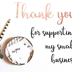 May include: A flat lay image with the text "Thank you for supporting my small business" in rose gold and black script. A succulent, pen, and small dish with a note that says "inspire" are also visible.