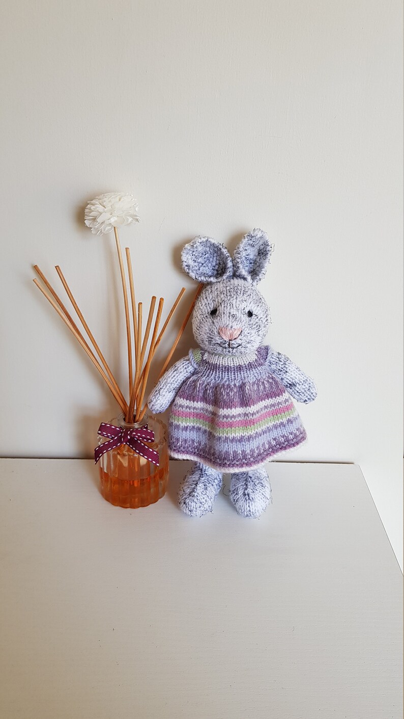 Harriet is eagerly awaiting adoption and can/'t wait to meet her new family Hand knitted bunny Multicolored dress Nursery prop.