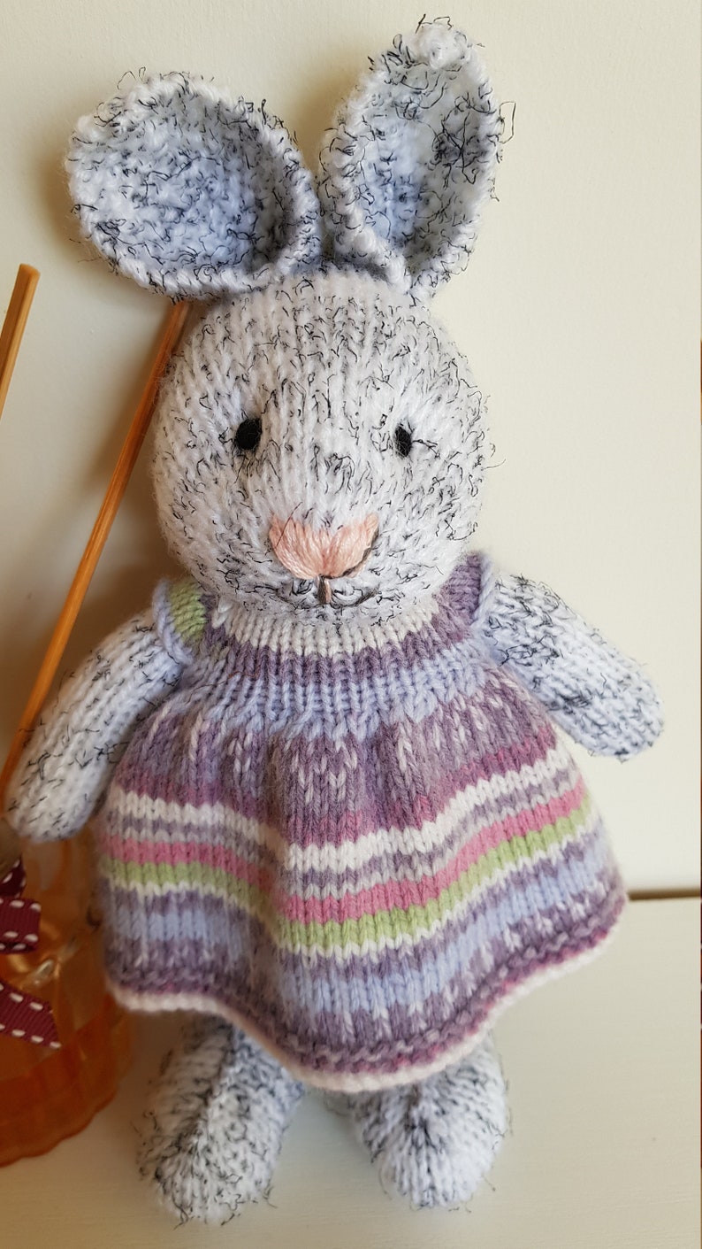 Harriet is eagerly awaiting adoption and can/'t wait to meet her new family Hand knitted bunny Multicolored dress Nursery prop.