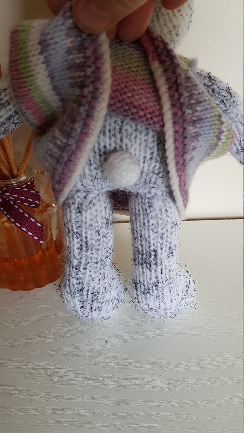 Harriet is eagerly awaiting adoption and can/'t wait to meet her new family Hand knitted bunny Multicolored dress Nursery prop.