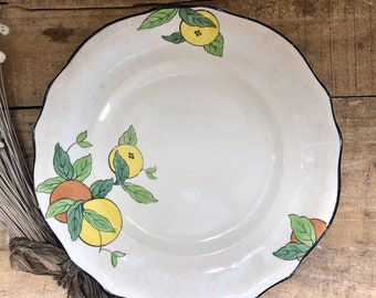 Plato vintage de cerámica con naranjas y limones