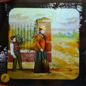 Magic Lantern Slide - Victorian Scene - Woman Walking & a Boy Carring her Bag