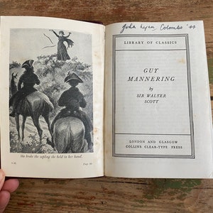May include: A vintage paperback book titled "Guy Mannering" by Sir Walter Scott. The book is part of the "Library of Classics" series and was published by Collins Clear-Type Press in London and Glasgow.