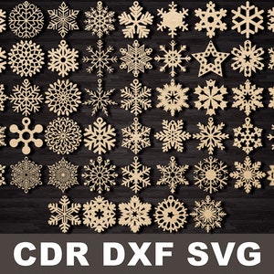 May include: A set of 48 laser cut snowflake designs in a variety of shapes and sizes. The snowflakes are made of wood and are ideal for crafting projects.