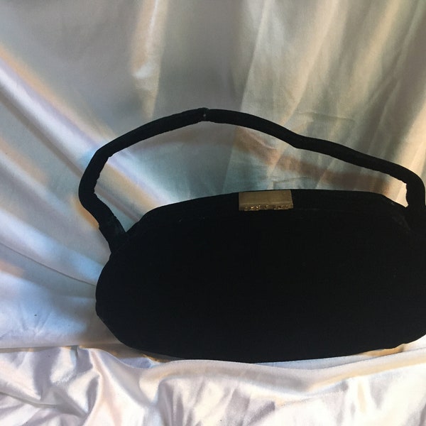 Vintage 50s Velvet Wrist/Clutch Purse w/brass latch.  Oval Shape.  Made for Garay.  Great for casual night with a black dress.