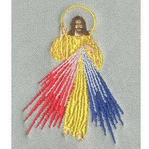 Puede incluir: Imagen bordada de Jesucristo con un halo dorado, vistiendo una túnica amarilla y radiando rayos de luz rojos, blancos y azules.