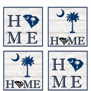 May include: Four square white wood signs with blue lettering that reads "Home" with a South Carolina state flag design in the center of each sign. The flags feature a crescent moon and palmetto tree.