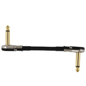 May include: A black guitar cable with gold-plated right-angle 1/4 inch plugs.