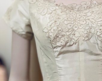 1950s From the Audrey Hepburn Collection comes this Authentic Silk Peau de Soie & Pearl Beading on French Guipure Lace Wedding Gown  Sz S/XS