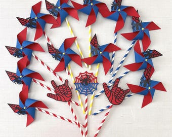 Red and blue pinwheels with spiderweb and spider