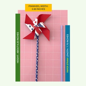 May include: A red, white, and blue pinwheel with a 3.60 inch width, attached to a blue and white striped paper straw. The straw is 7.75 inches long. The pinwheel is on a pink gridded surface.