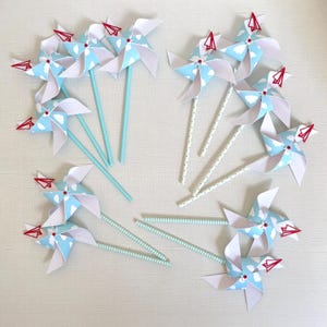 Paper plane theme pinwheels | Time flies theme pinwheels | Red and blue pinwheels