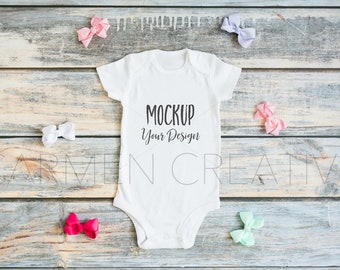 Download Free Baby Girl Bodysuit Mockup With Bows Bodysuit Mockup On Wood Pregnancy Announcement Photo Digital Download PSD Mockup Template