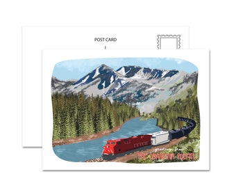 May include: A postcard featuring a red, white, and black train traveling through a mountain valley with a river running alongside the tracks. The text on the postcard reads "Greetings from The Canadian Rockies".