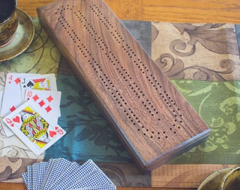 Walnut Cribbage board with 2 tracks and storage for pegs and cards