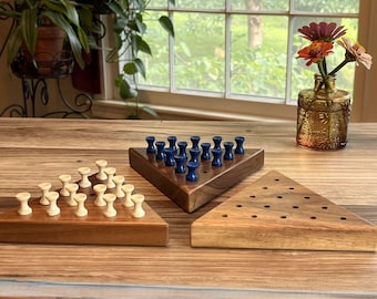 Triangle peg solitaire game, solid walnut, wooden pegs (one game included)