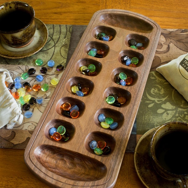 Wooden mancala board with glass pieces in walnut or cherry