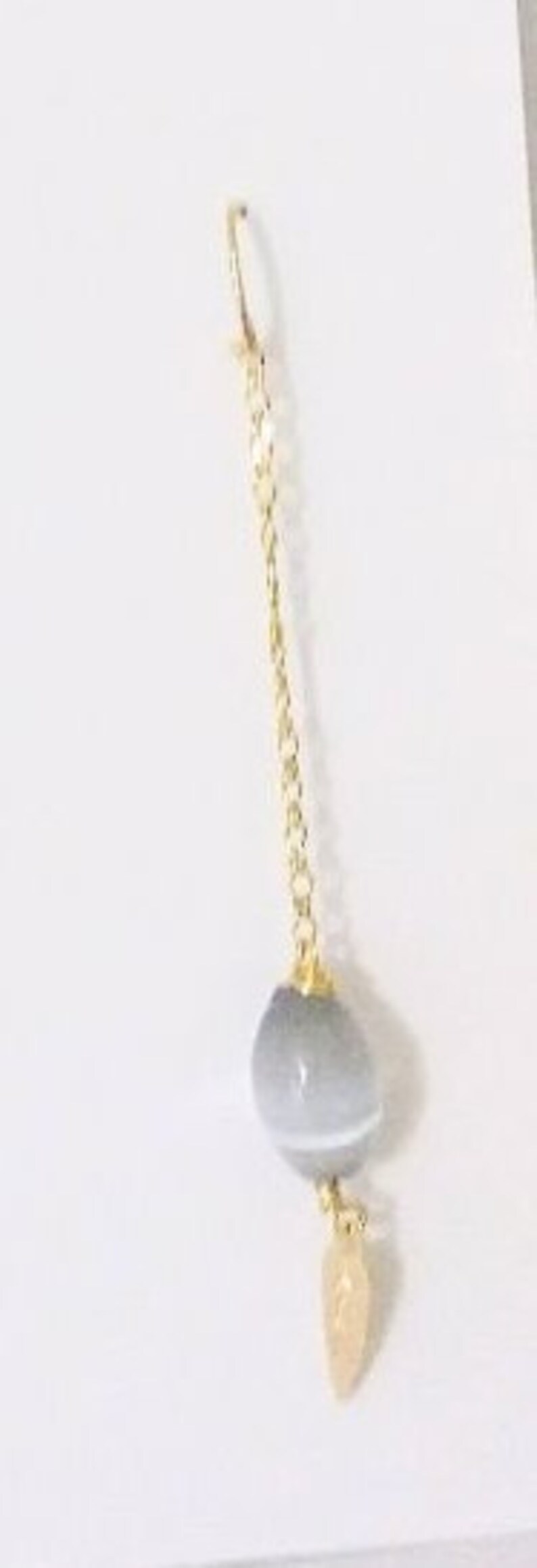 One Cat/'s Eyes Gray Crystal in a long 18K Gold Filled Chain hanging from a Gold Filled Wire Hook