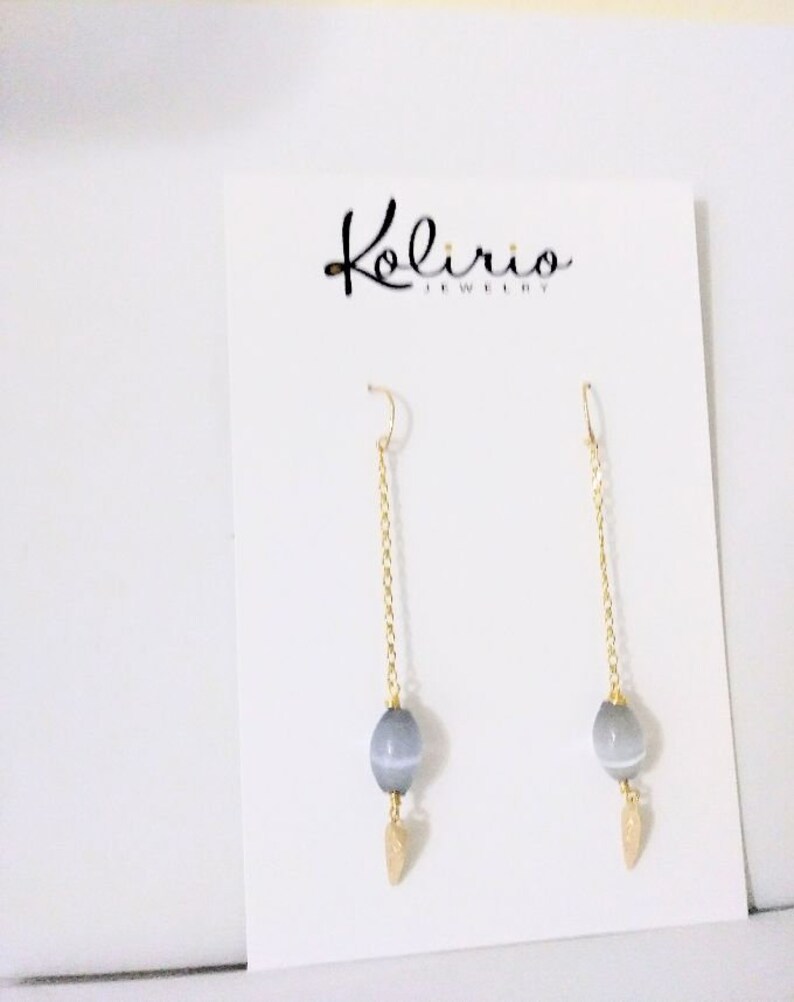 One Cat/'s Eyes Gray Crystal in a long 18K Gold Filled Chain hanging from a Gold Filled Wire Hook