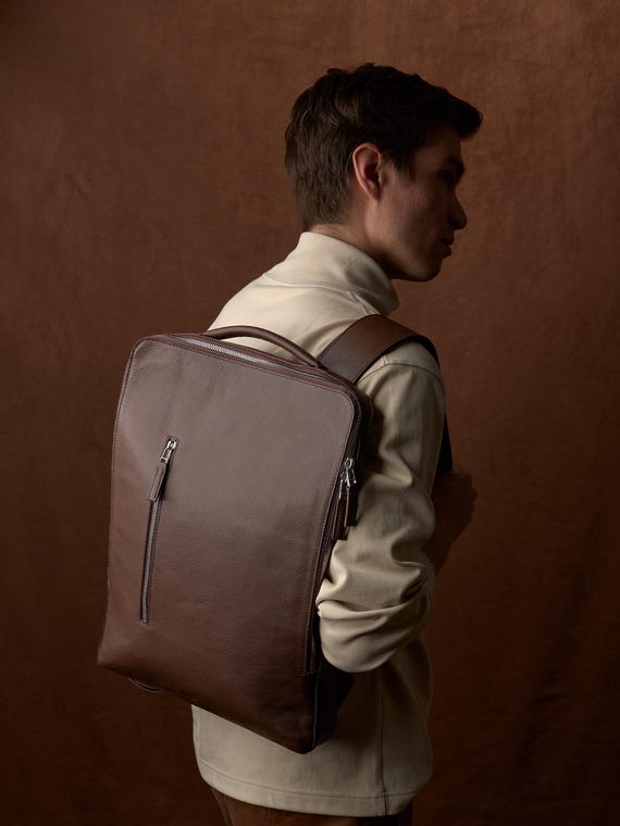 best looking business slim laptop backpack Office Work Unisex Ultralight Bags Updated Version The luggage strap on the back keeps the backpack stayed on the suitcase tightly. Best Business Laptop Backpacks |