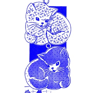 May include: Blue and white illustration of two cats, one with a checkered pattern and the other with a dotted pattern. The image is titled "Needlecraft Corner 5321".