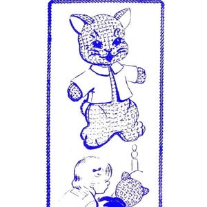 May include: A vintage craft pattern for making a stuffed toy cat. The pattern shows a blue line drawing of a cat wearing a shirt and a girl holding a cat. The pattern number is 875.