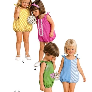 May include: A sewing pattern envelope labeled B3988, Size 2, Breast 21, featuring illustrations of four children wearing different versions of a sleeveless romper with tie-shoulder straps. The designs include yellow gingham, solid pink, green with a pocket, and blue with white stripes.