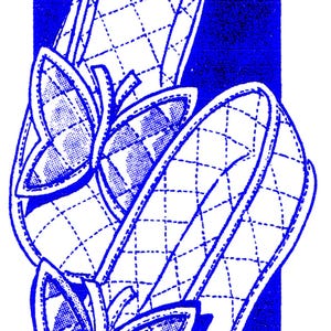 May include: A pair of white quilted slippers with butterfly trim. The slippers are shown on a blue background. The text "5284" and "QUILTED SLIPPERS WITH BUTTERFLY TRIM" are printed above the slippers.