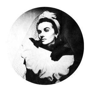 May include: A vintage black and white portrait of a woman wearing a hat with a veil. The woman is positioned in a circular frame, with a white ruffled collar. The image is a classic representation of vintage fashion.