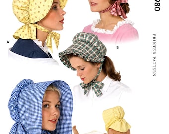 May include: A sewing pattern envelope labeled M1980 for Misses' and Girls' Sunbonnets. The image displays four variations of sunbonnets: a yellow floral print, a red and white gingham check, a green plaid, and a blue and white gingham check.