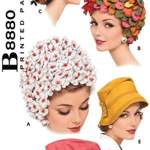 May include: A sewing pattern envelope labelled B8880 Printed Patterns for a 22-inch head measure. It displays five hat styles: a black netted cap, a multi-coloured petal cap, a white floral cap, a yellow bucket hat, and a pink hat with a bow.