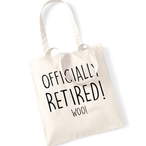 May include: A cream-coloured tote bag featuring the text "OFFICIALLY RETIRED! WOO!" in black. The bag has two handles and is made from a soft, durable material. A celebratory gift for someone's retirement.