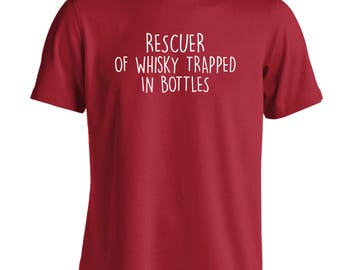 May include: A dark red short-sleeved t-shirt featuring white text printed on the chest that reads: RESCUER OF WHISKY TRAPPED IN BOTTLES. The garment has a crew neckline and a standard fit, showcasing a solid color design with clear lettering.