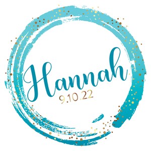 May include: A blue and gold circle with the name "Hannah" and the date "9.10.22" written in gold.