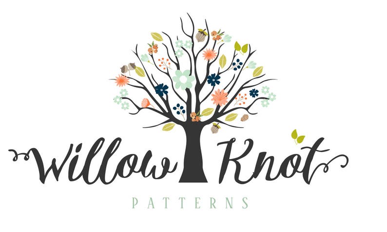 May include: A logo for a company called "Willow Knot Patterns" featuring a stylized tree with a dark gray trunk and branches. The tree is decorated with various colored flowers and leaves, including blue, green, pink, and orange.