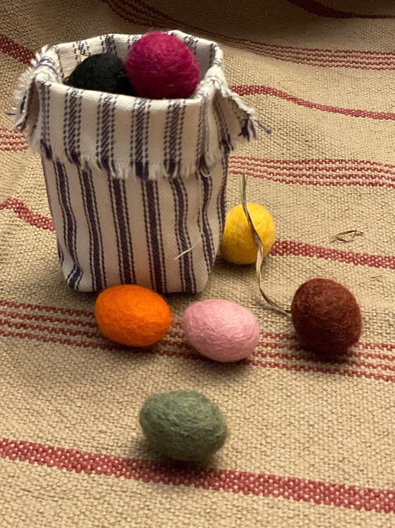 Primitive Colors 100% Felted Wool Eggs, 3/4 or 1 with krinkled kraft grasses in a ticking basket image 1