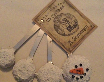 In the Meadow We Can Build a Snowman made with vintage measuring spoons