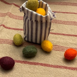 Primitive Colors 100% Felted Wool Eggs, 3/4 or 1 with krinkled kraft grasses in a ticking basket image 3