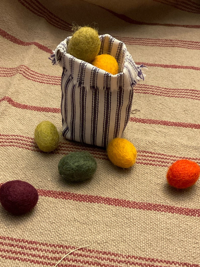 Primitive Colors 100% Felted Wool Eggs, 3/4 or 1 with krinkled kraft grasses in a ticking basket image 3