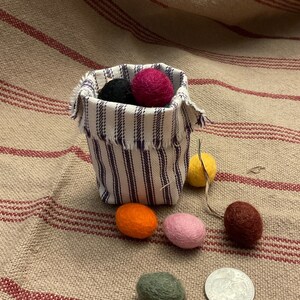 Primitive Colors 100% Felted Wool Eggs, 3/4 or 1 with krinkled kraft grasses in a ticking basket image 2