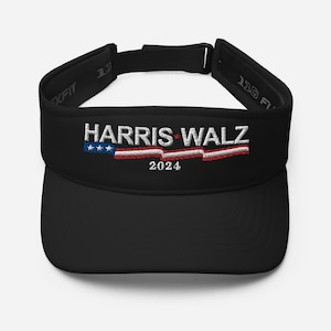 May include: Black visor with a white embroidered design that says "HARRIS WALZ 2024" with a red, white and blue American flag design.