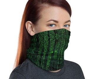 May include: A black and green face mask with a pattern of green code on a black background. The mask is worn by a person with red hair.