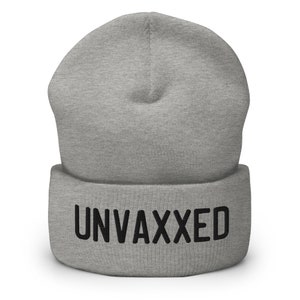 May include: Gray beanie with the word "UNVAXXED" in black lettering.