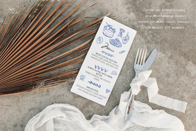 May include: A flat lay featuring a menu with blue illustrations and text, a fork and knife tied with a white ribbon, and a dried palm leaf. The menu lists Mediterranean dishes.