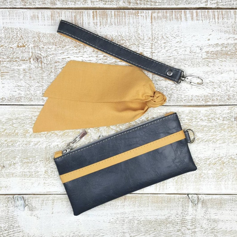 navy and mustard clutch bag